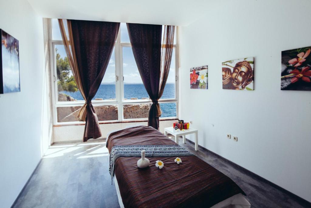 A bed or beds in a room at Europe Playa Marina - Adults Only
