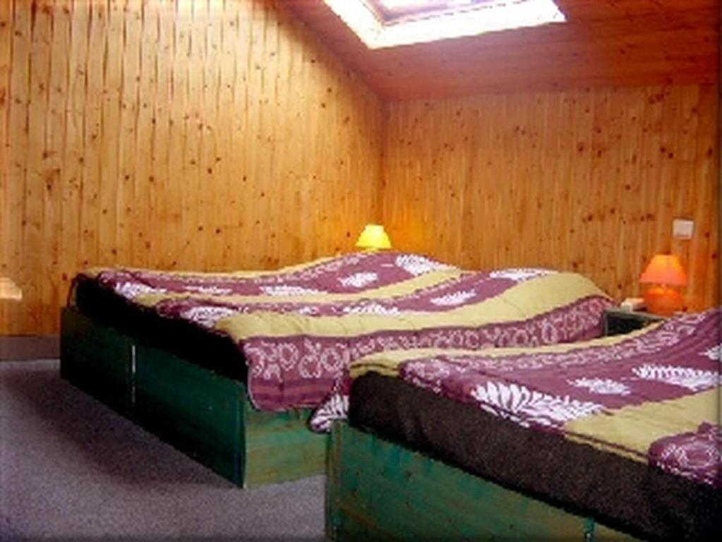 Postel nebo postele na pokoji v ubytování Hotel Les Sapins