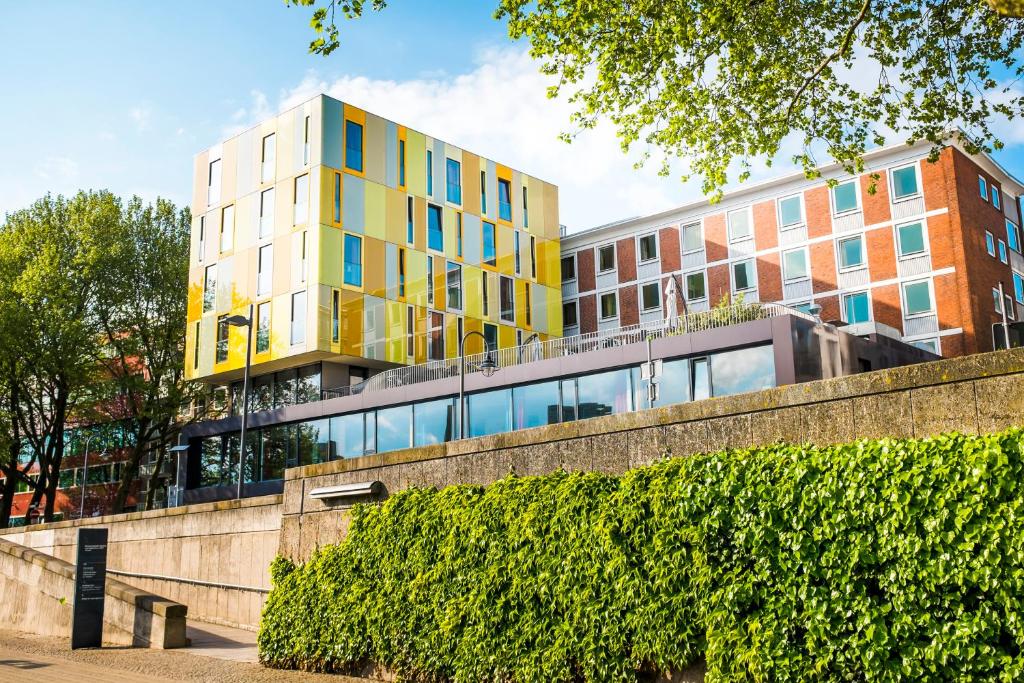a yellow building on top of a brick wall at Jugendherberge Bremen in Bremen
