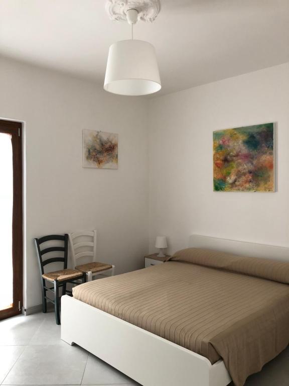 Postel nebo postele na pokoji v ubytování De Nittis' Rooms