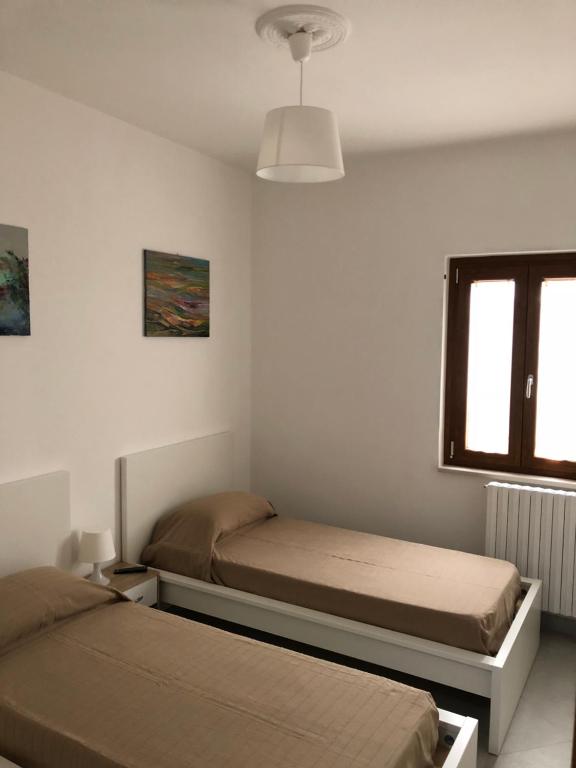 Postel nebo postele na pokoji v ubytování De Nittis' Rooms