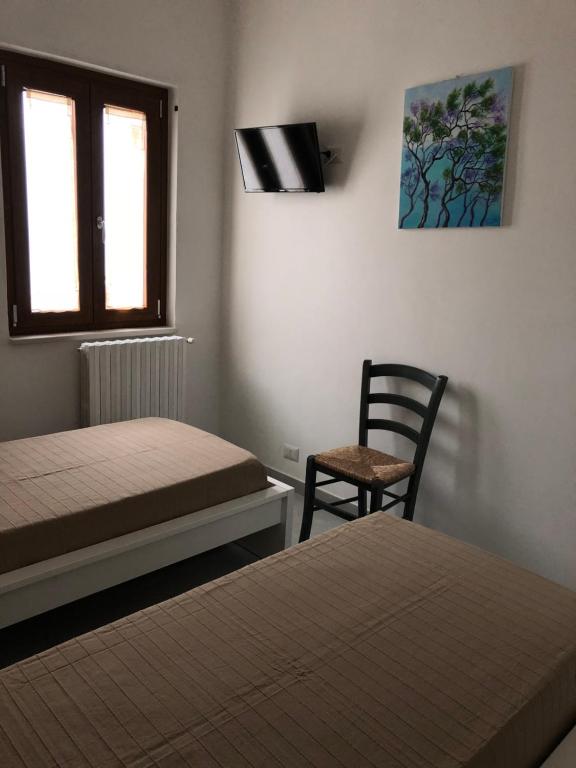 Postel nebo postele na pokoji v ubytování De Nittis' Rooms