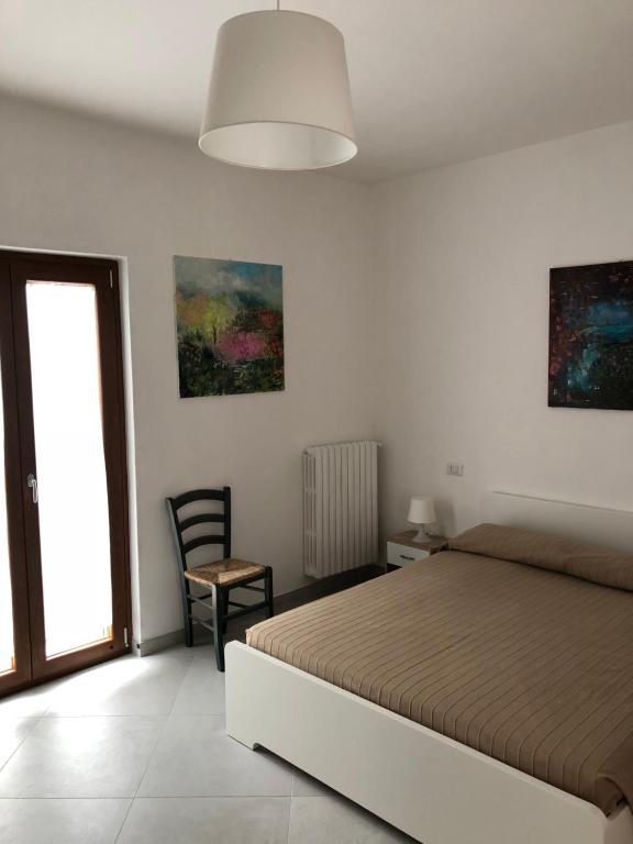 Postel nebo postele na pokoji v ubytování De Nittis' Rooms