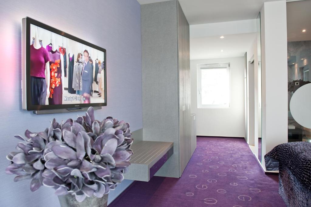 Postel nebo postele na pokoji v ubytování G Design Hotel