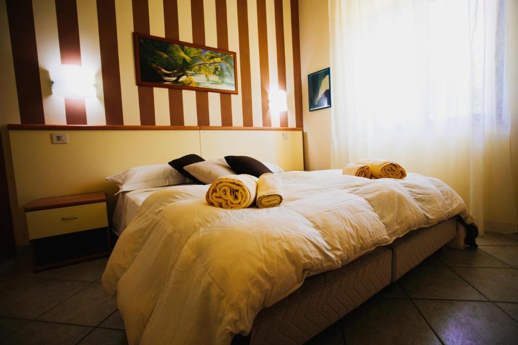Postel nebo postele na pokoji v ubytování Fonte Di Bagnaria