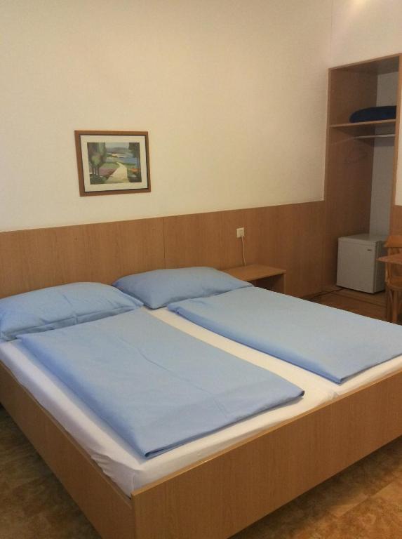 Postel nebo postele na pokoji v ubytování Hotel Pribitzer