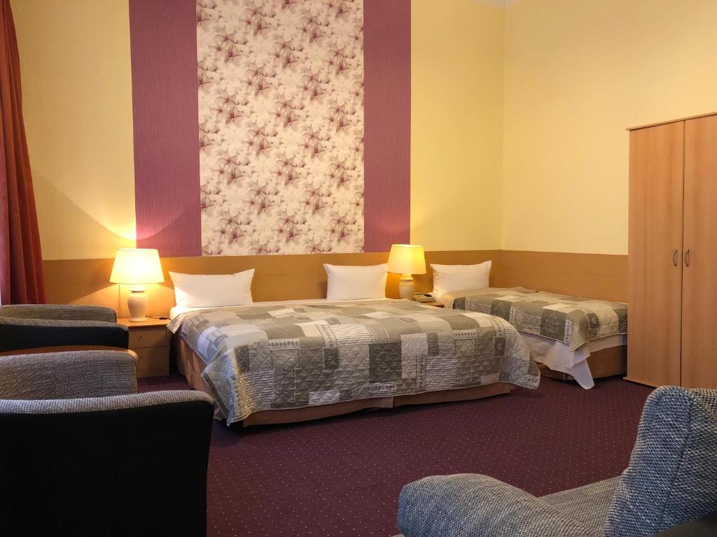 Postel nebo postele na pokoji v ubytování Hotel Castell am Kurfürstendamm