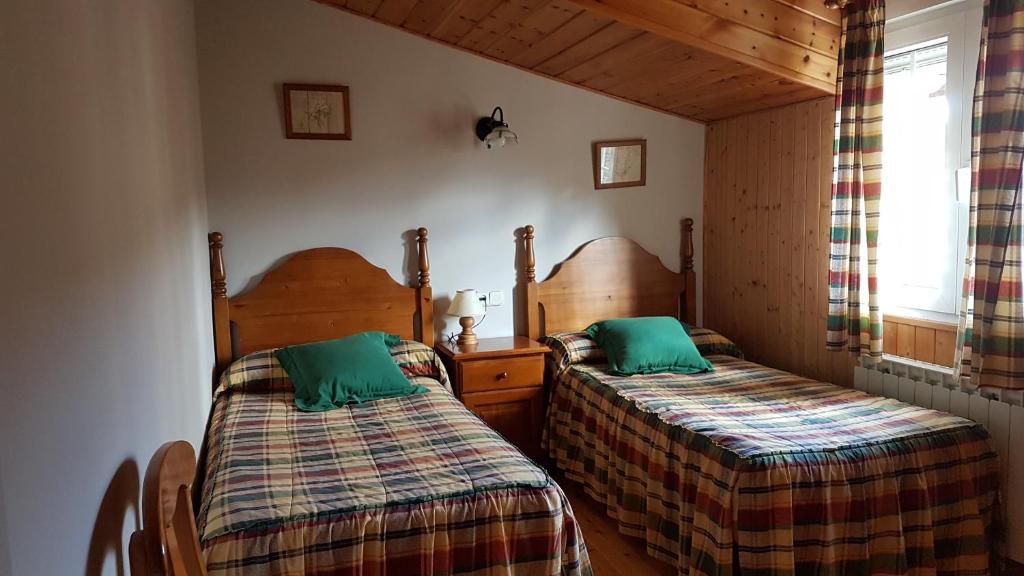 Katil atau katil-katil dalam bilik di La Puente 9 de Gredos