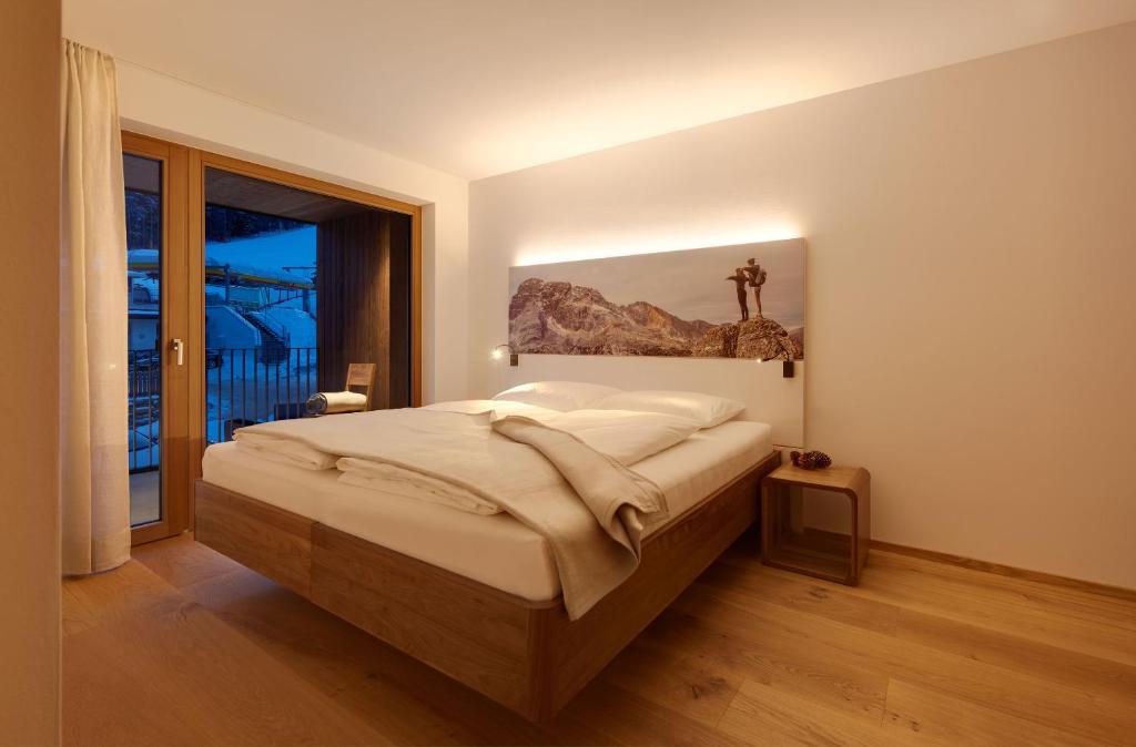 Łóżko lub łóżka w pokoju w obiekcie Living Nature Appartements