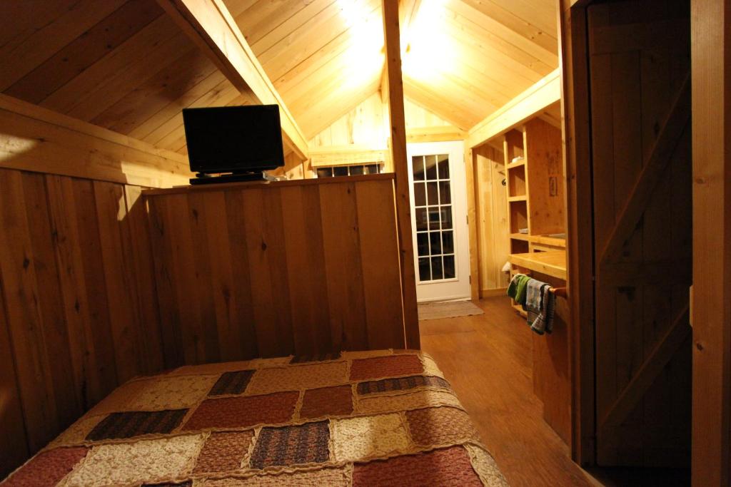 TV a/nebo společenská místnost v ubytování Chalets Nature Océan