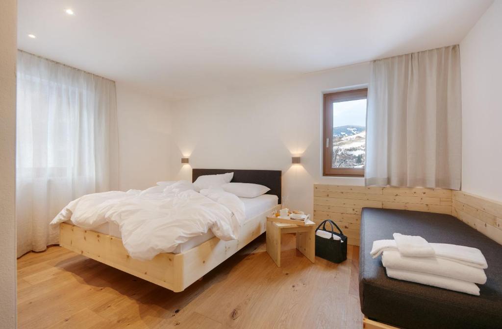 Łóżko lub łóżka w pokoju w obiekcie Living Nature Appartements