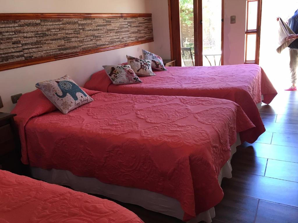 Postel nebo postele na pokoji v ubytování Hostal Puritama