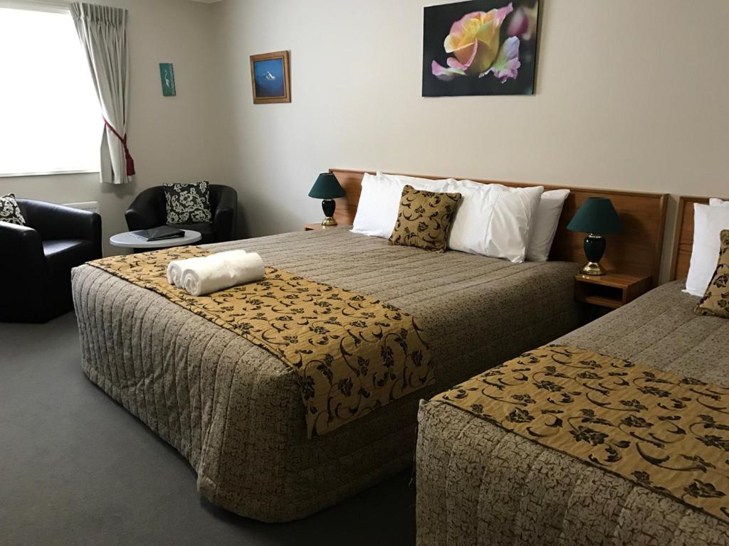 Postel nebo postele na pokoji v ubytování High Peaks Hotel