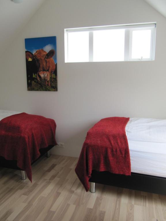 Rúm í herbergi á Grand-Inn Bar and Bed