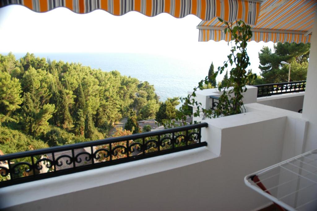 a balcony with a view of the ocean at Villa Dulsinea in Ulcinj