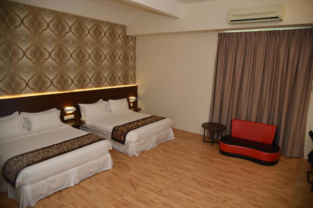Postel nebo postele na pokoji v ubytování Casa Bonita Hotel