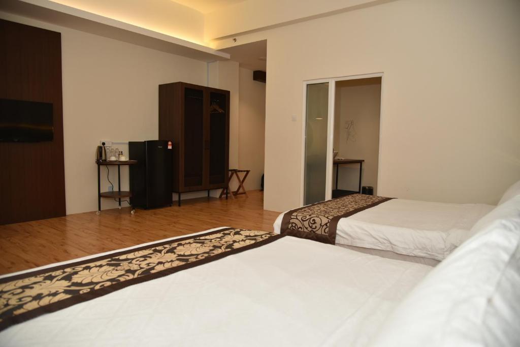 Postel nebo postele na pokoji v ubytování Casa Bonita Hotel