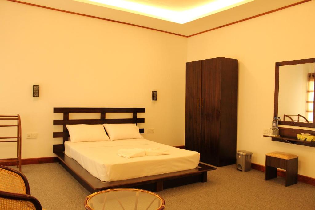 Postel nebo postele na pokoji v ubytování Nico Lagoon Hotel