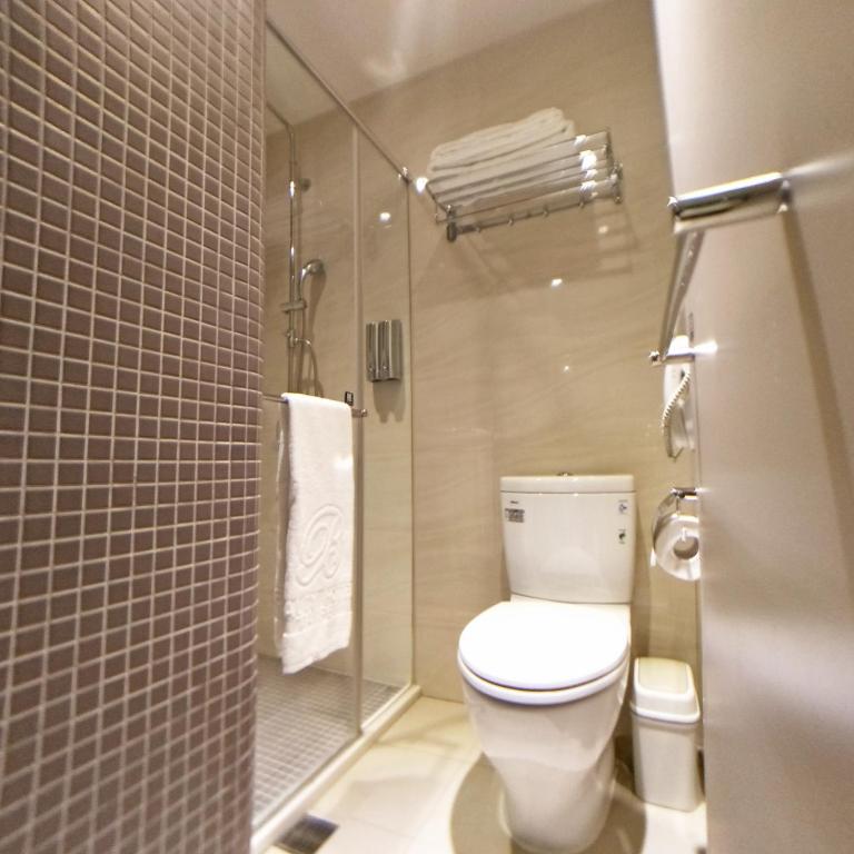a bathroom with a toilet and a shower at Beauty Hotels Taipei - Hotel B6 in Taipei