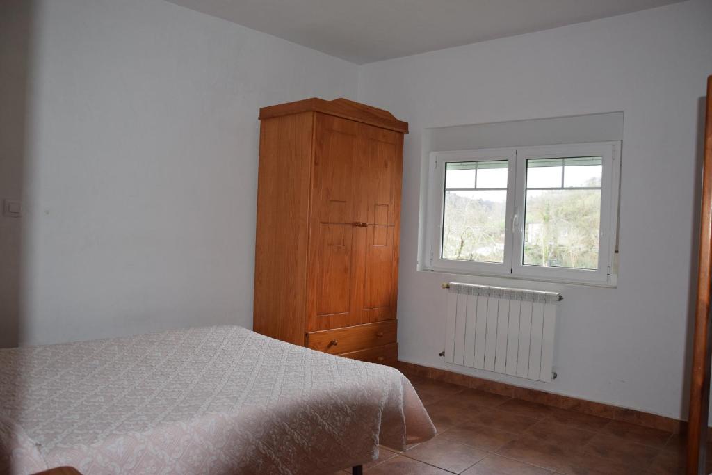 Postel nebo postele na pokoji v ubytování Apartamentos Arredondo