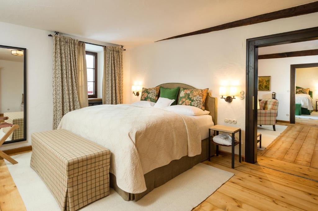 Postel nebo postele na pokoji v ubytování Schloss Prielau Hotel & Restaurants