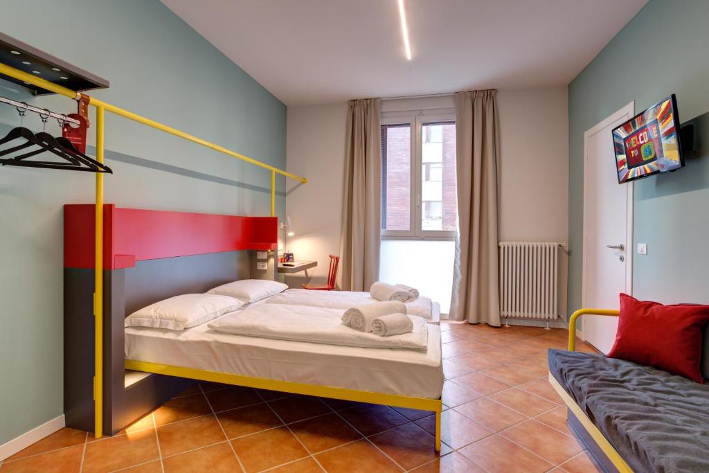 Postel nebo postele na pokoji v ubytování MEININGER Milano Garibaldi