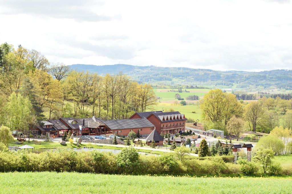 an aerial view of a large building in a field at Resort Hulín in Sedlčany