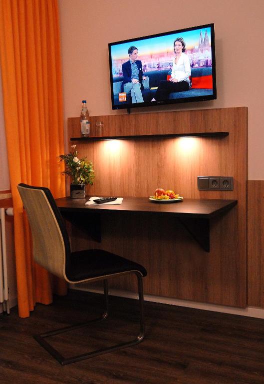 TV a/nebo společenská místnost v ubytování Garni Hotel Leitl GmbH