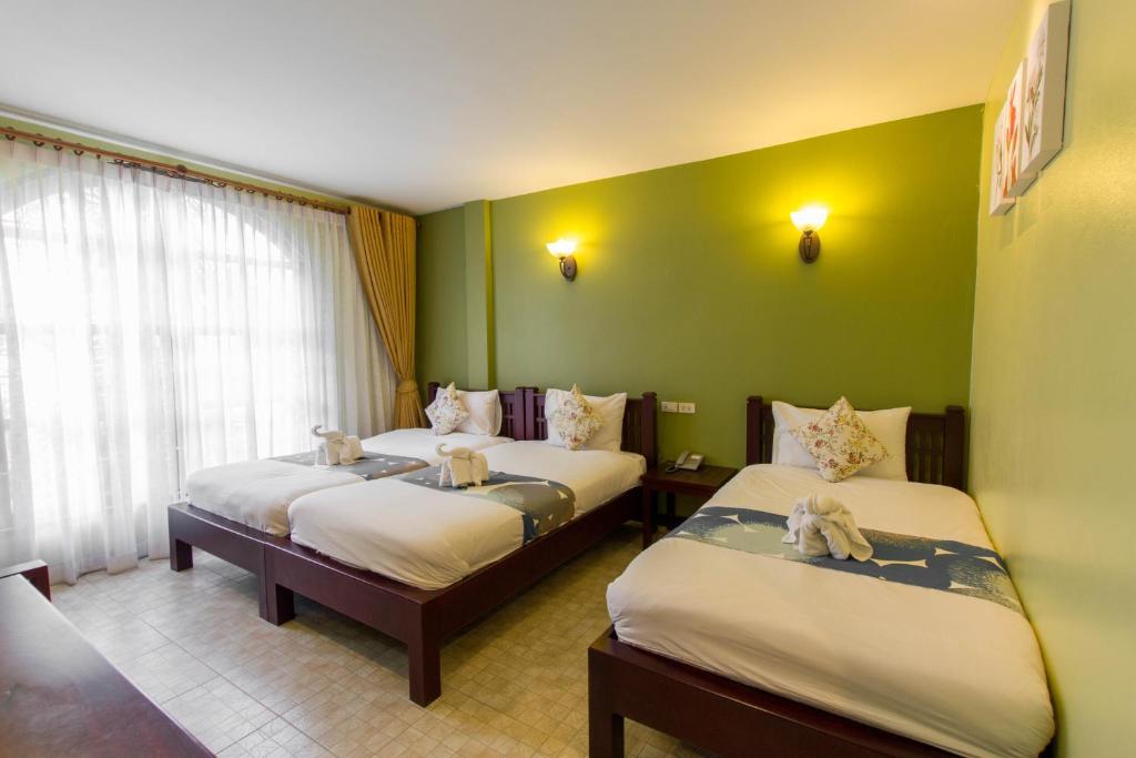 Postel nebo postele na pokoji v ubytování La Villa Boutique hotel