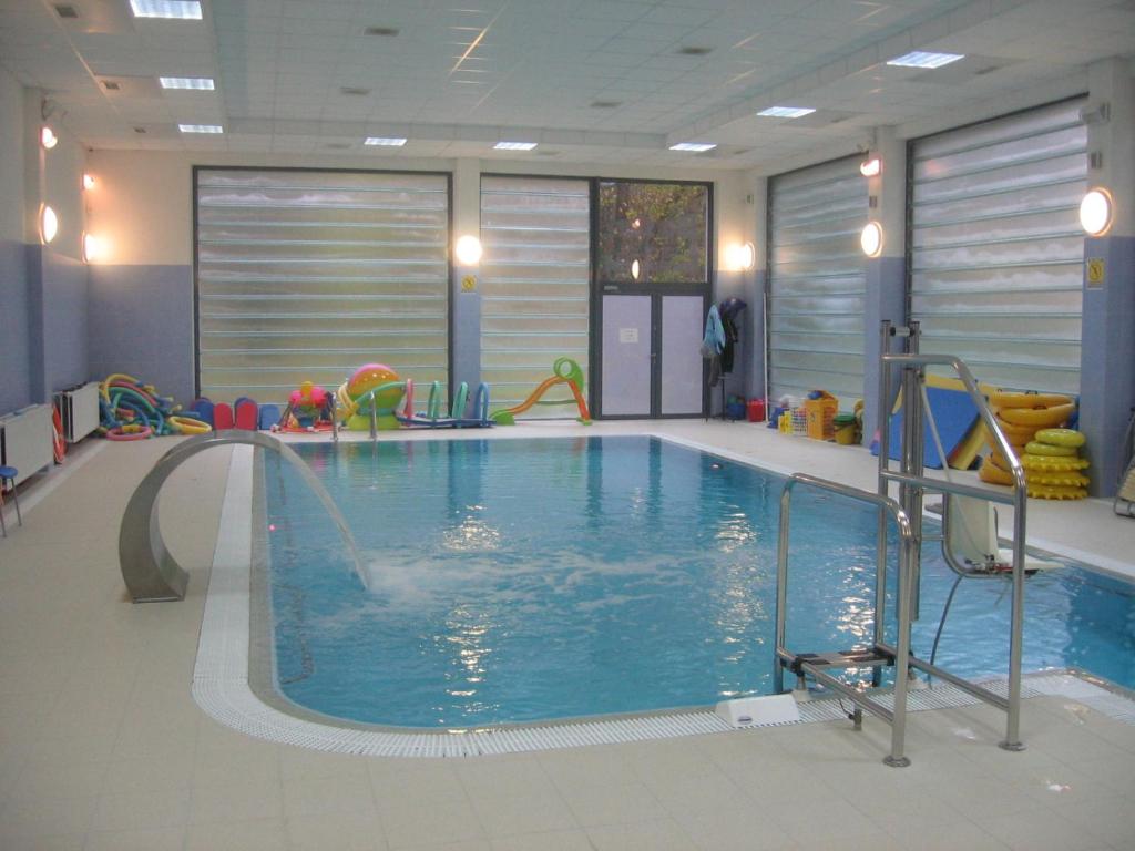 a indoor swimming pool with a water slide at Sasanka in Świnoujście