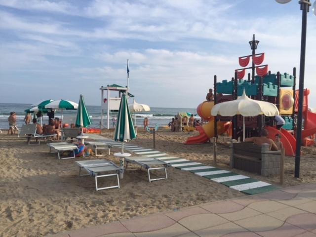 a playground on the beach with a water park at Casa Pineta in Lido di Jesolo
