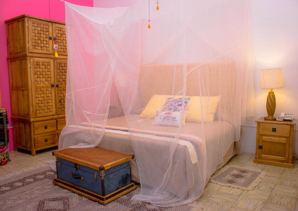 Postel nebo postele na pokoji v ubytování Casona Tlaquepaque Temazcal & Spa