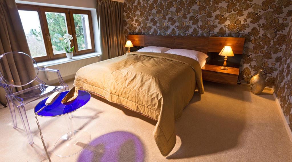 Un pat sau paturi într-o cameră la Residence Arx & Wellness