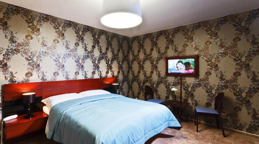 Cama o camas de una habitación en Residence Arx & Wellness