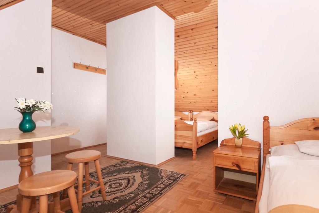 A bed or beds in a room at Privát Gallik