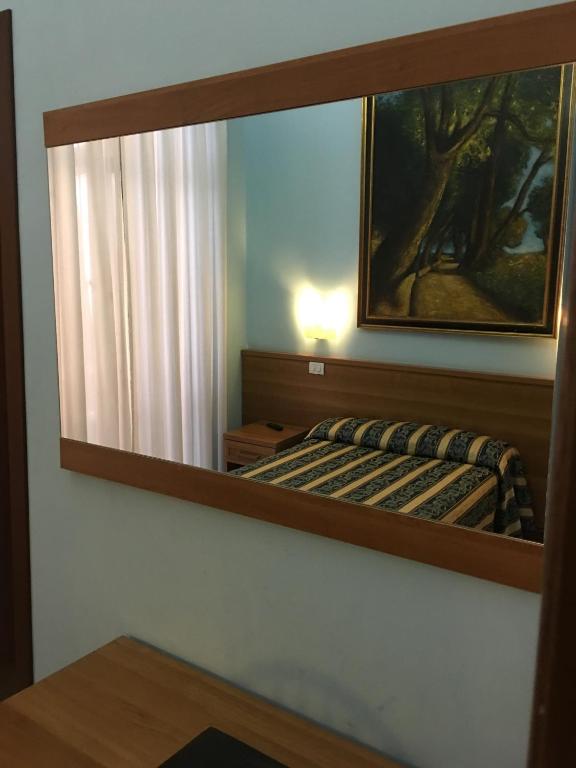 Postel nebo postele na pokoji v ubytování Hotel Bolognese