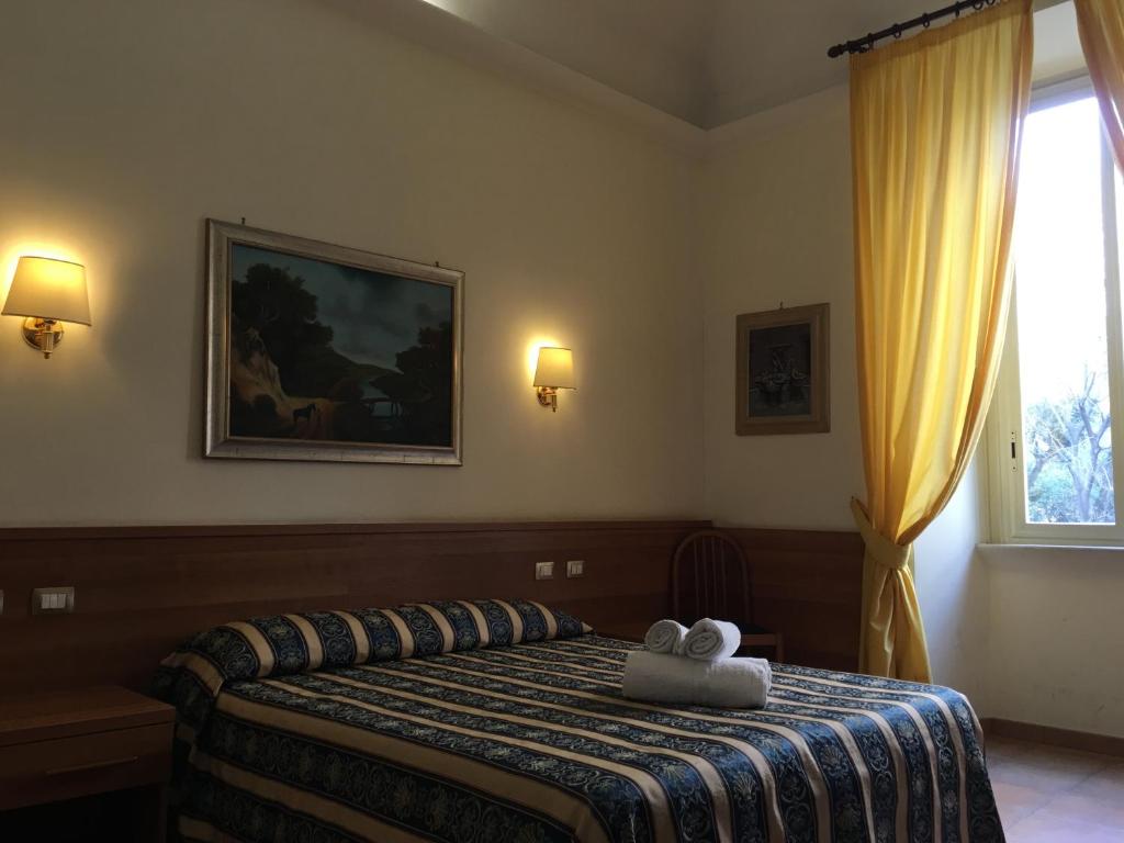 Postel nebo postele na pokoji v ubytování Hotel Bolognese
