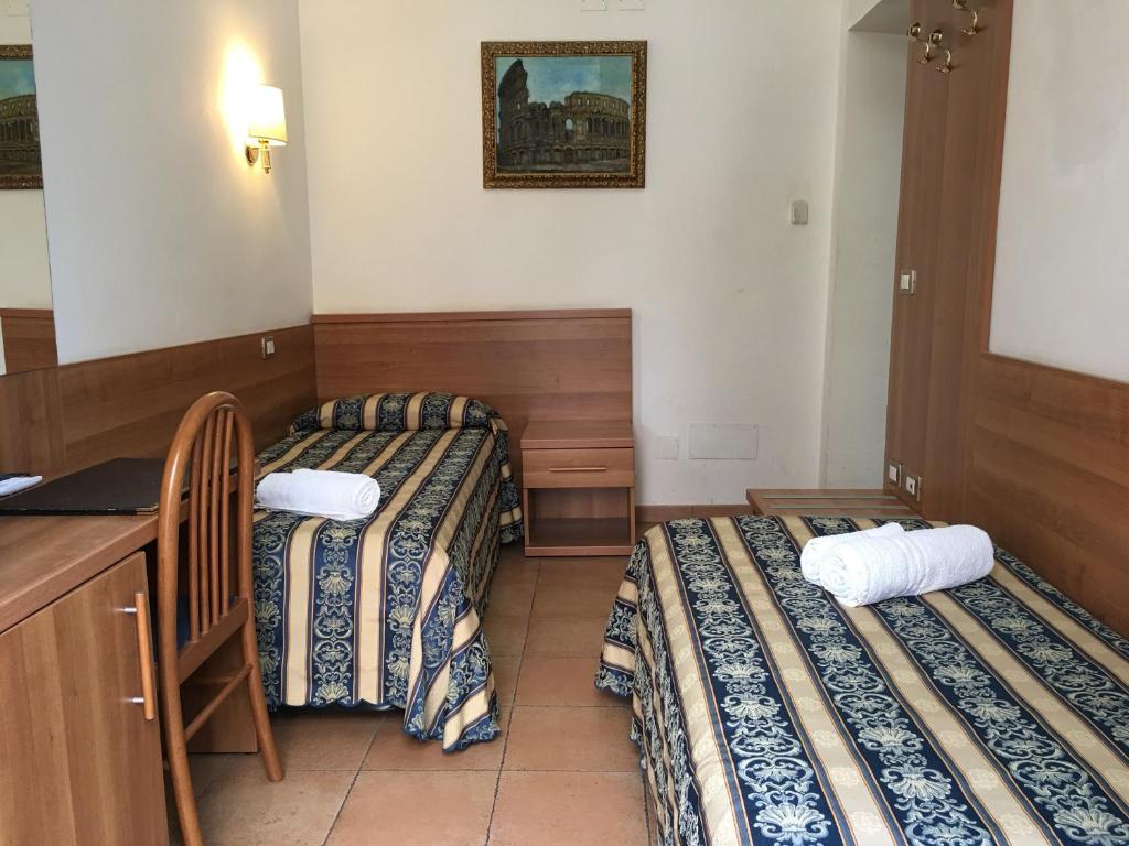 Postel nebo postele na pokoji v ubytování Hotel Bolognese