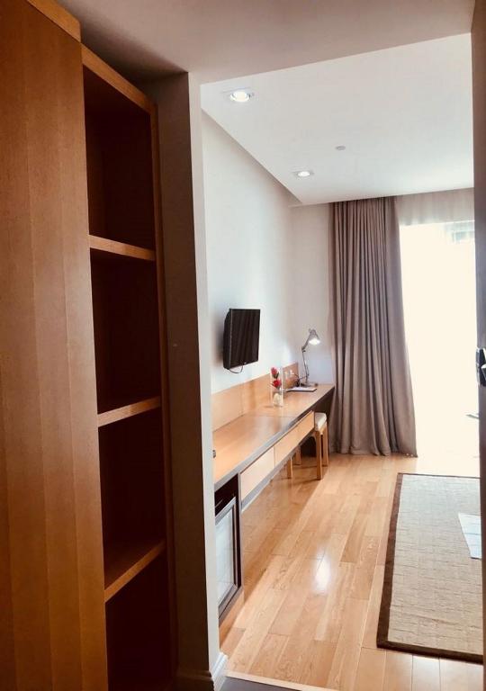 TV a/nebo společenská místnost v ubytování Pefaco Hotel Maya Maya