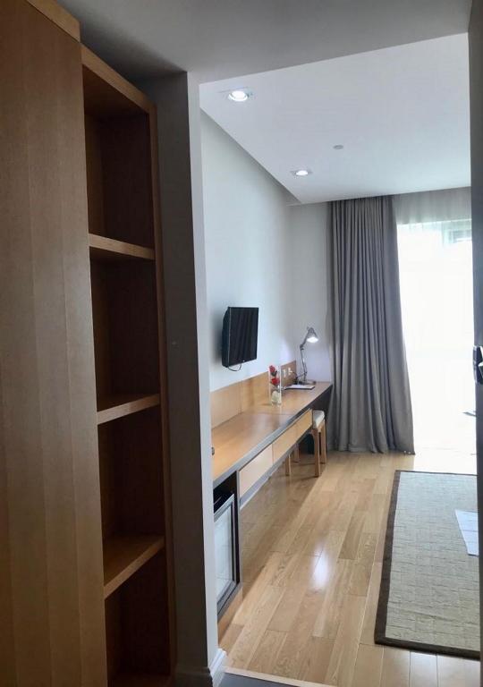 TV a/nebo společenská místnost v ubytování Pefaco Hotel Maya Maya