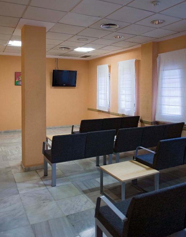 TV a/nebo společenská místnost v ubytování Albergue Inturjoven Sevilla