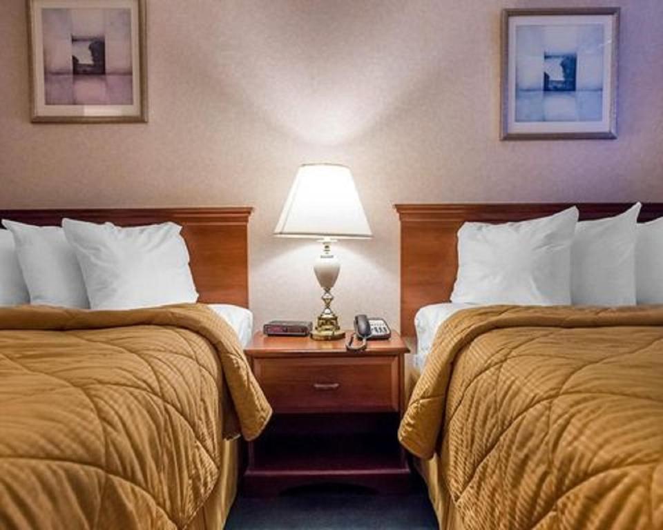 Postel nebo postele na pokoji v ubytování Econo Lodge
