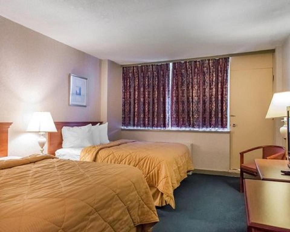 Postel nebo postele na pokoji v ubytování Econo Lodge