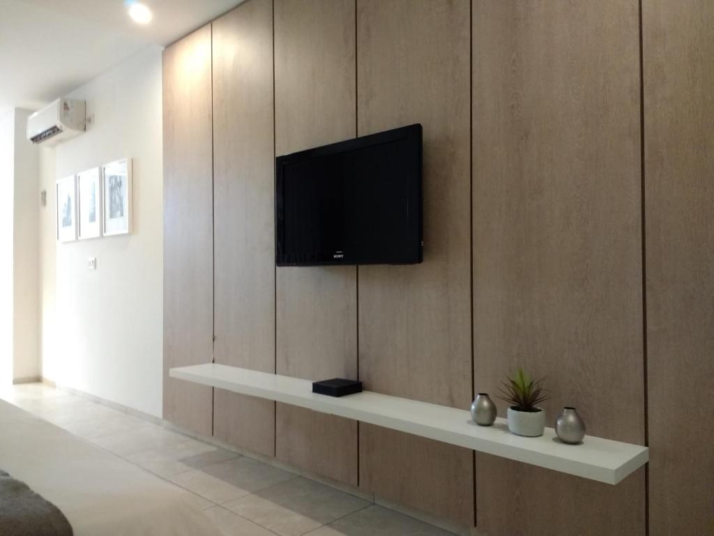 TV a/nebo společenská místnost v ubytování Departamentos Lugar