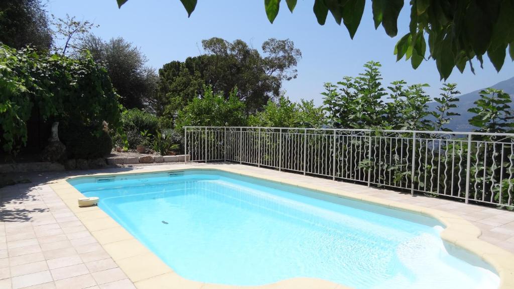 a swimming pool with a fence around it at L'Aleandra in Castellar