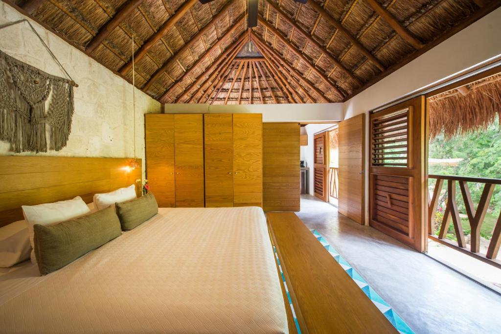 Кровать или кровати в номере Prana Boutique Hotel Tulum
