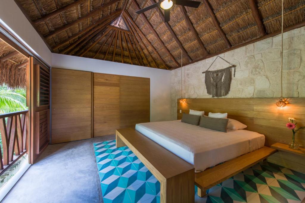 Кровать или кровати в номере Prana Boutique Hotel Tulum