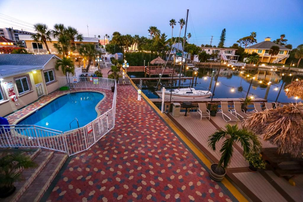 a view of a swimming pool at night at Bay Palms Waterfront Resort - Hotel and Marina in St Pete Beach