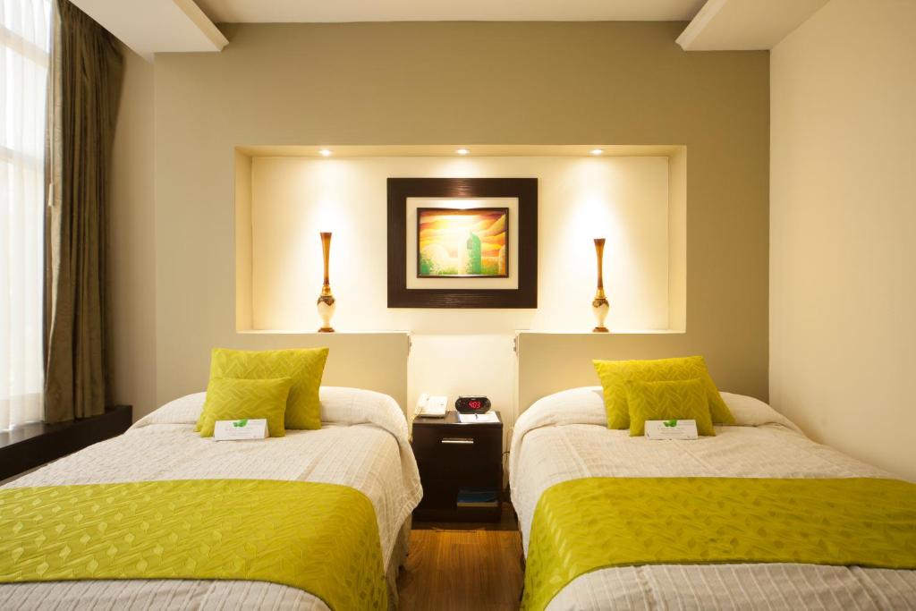 Postel nebo postele na pokoji v ubytování Hotel Ramada