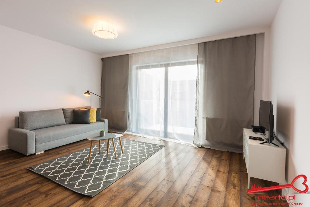 Televízia a/alebo spoločenská miestnosť v ubytovaní Apartments Nearto Old Town Rakowicka